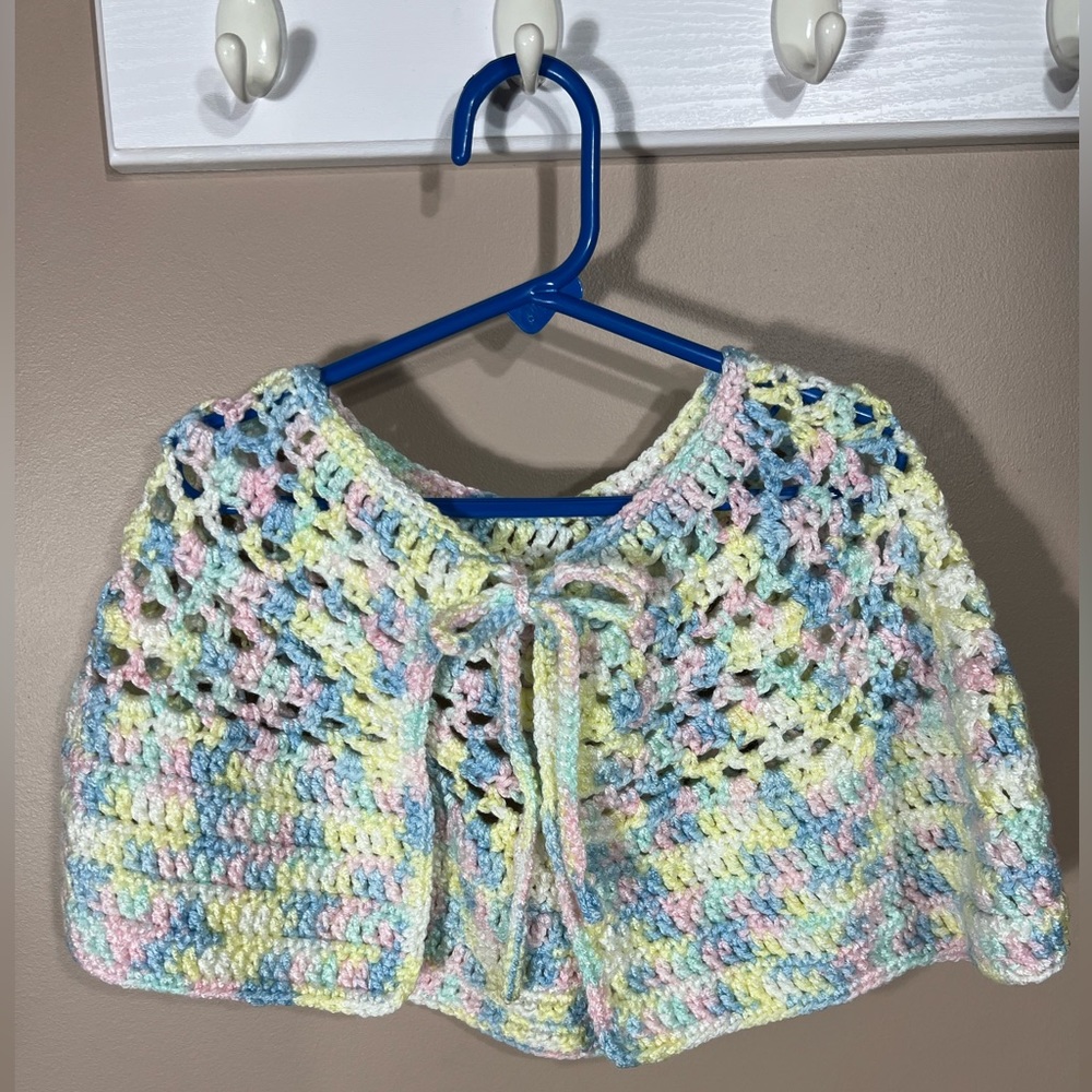 Shimmery soft pastel poncho. Handmade by Mom. Fits most children aged 5-7 years.
